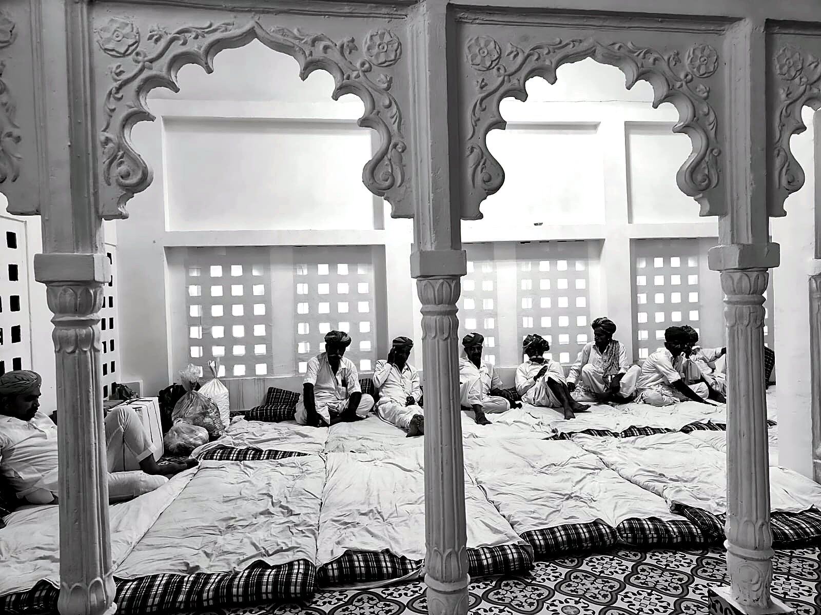 Guests gathered beneath carved archways